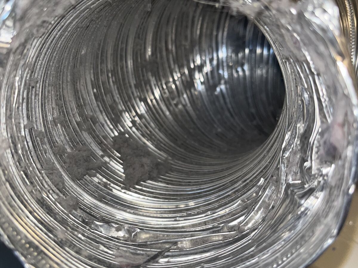 Interior view of a clean flexible dryer transition duct after cleaning