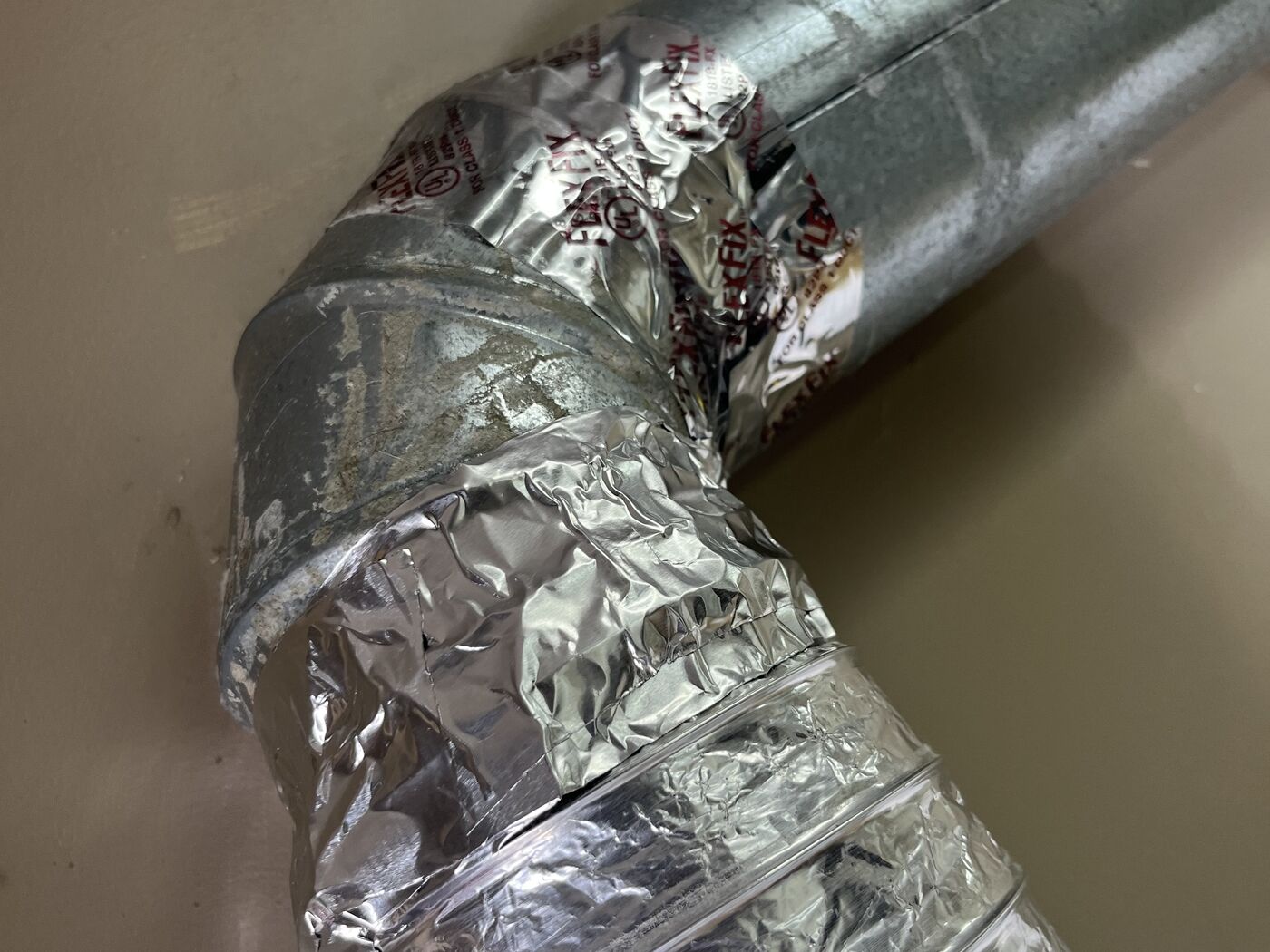 Clean commercial dryer transition duct after service